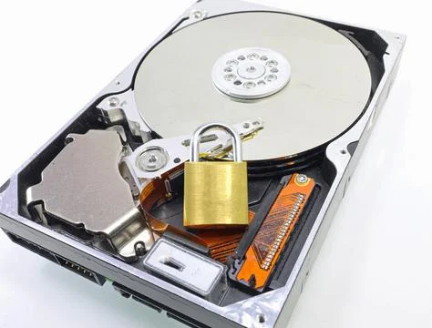 Hard disk computer with padlock symbolizing encryption secret data Stock Photos