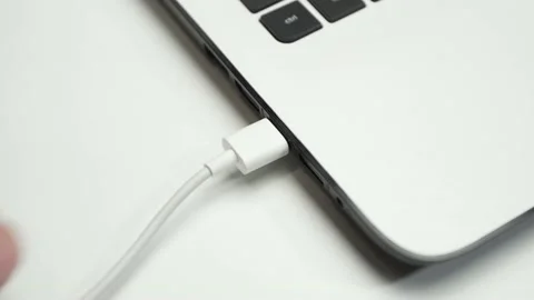 Hard disk connected to a laptop on white background Stock Footage 143866084