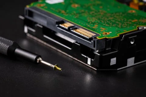 Hard disk drive and printed circuit board with SATA power connector. Magnet.. Stock Photos