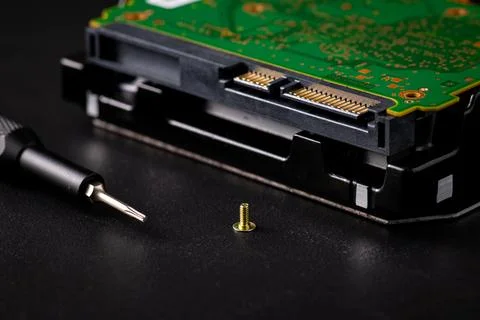Hard disk drive and printed circuit board with SATA power connector. Magnet.. Stock Photos