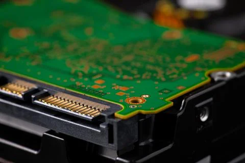 Hard disk drive and printed circuit board with SATA power connector. Magnet.. Stock Photos
