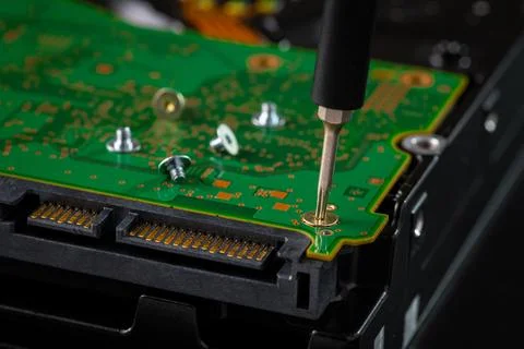 Hard disk drive and printed circuit board with SATA power connector. Magnet.. Stock Photos