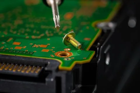 Hard disk drive and printed circuit board with SATA power connector. Magnet.. Stock Photos