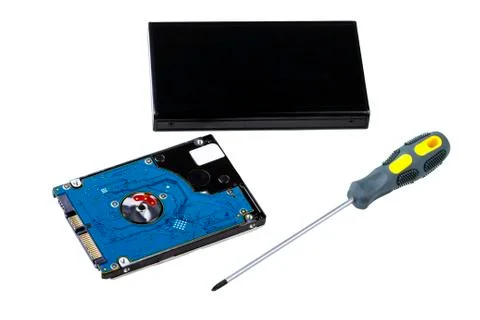 Hard disk drive, case and screwdriver Stock-Fotos