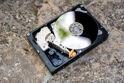 Hard disk drive on a concrete surface Stock Photos