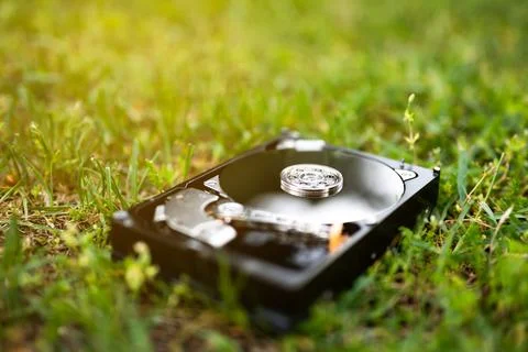 Hard disk drive on the grass Stock Photos