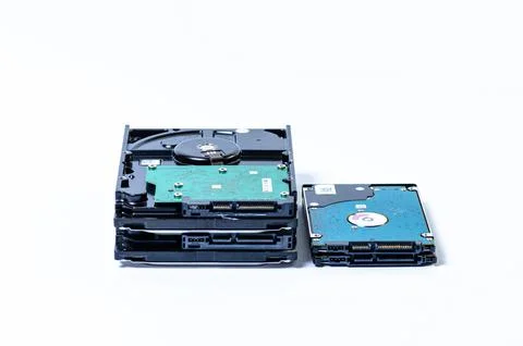 Hard disk drive HDD of different size isolated on white. Stock Photos