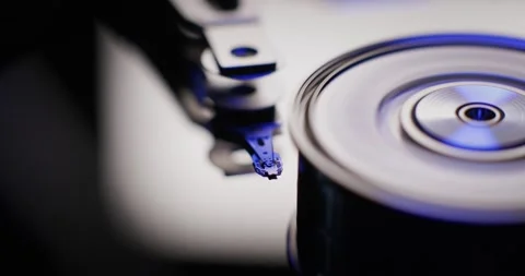 Hard disk drive inside. Turning on hard drive with a spinning platter. Stock Footage 176841784