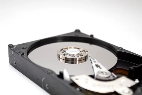 A hard disk drive isolated on white background. Closeup of opened HDD. Stock Photos