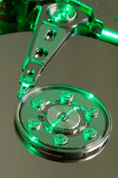 Hard Disk Drive Platter:  Inside a Hard Disk Drive with a Green Glow (macro) Stock Photos