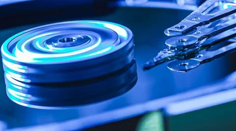 Hard disk drive reading data with blue light effect 스톡 사진