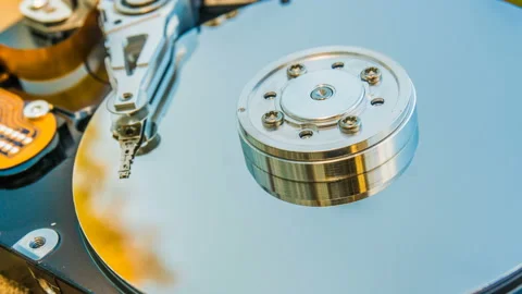 Hard disk drive with reflected in it the time-lapse of clouds, the concept of Stock Footage 96185372