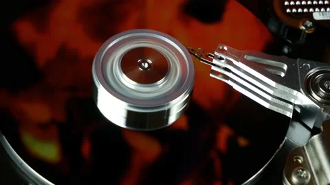 A hard disk drive reflects fire flames. Stock Footage 138758040