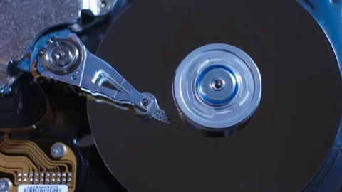 Hard disk drive with spinning platter. Spin up and stop. Stock Footage 80116904