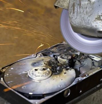 Hard disk driveand angle grinder detail shot of a massive destroyed hard d... Stock Photos