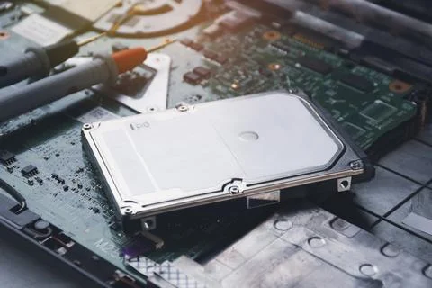 Hard disk drives 2.5 inch (HDD) placed on motherboard Stock Photos