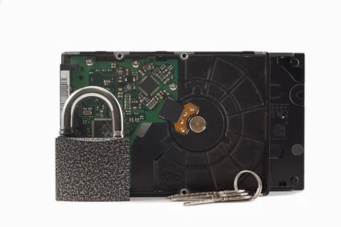 Hard disk, keys and padlock on a white background. The lock is locked. Stock Photos
