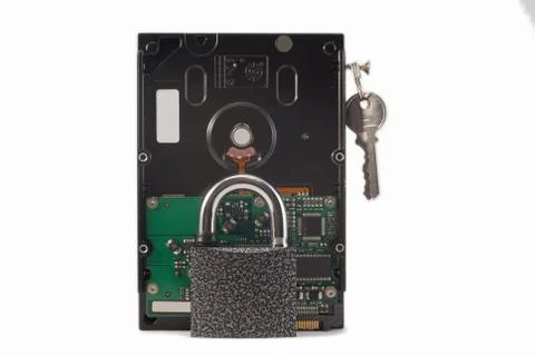 Hard disk, keys and padlock on a white background. The lock is locked. Stock Photos
