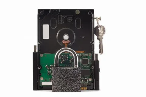 Hard disk, keys and padlock on a white background. The lock is locked. Stock Photos