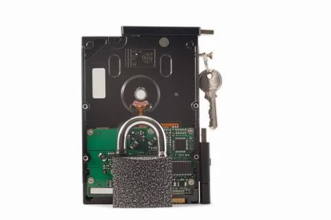Hard disk, keys and padlock on a white background. The lock is locked. Stock Photos