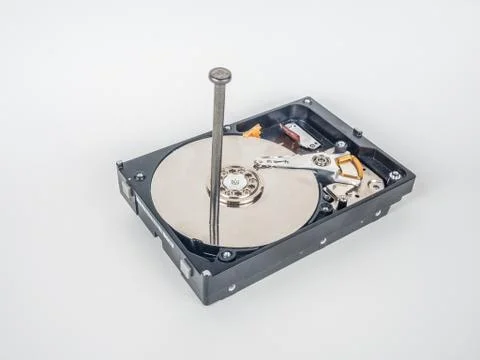 Hard disk with the nail Stock Photos