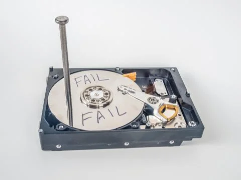 Hard disk with the nail Foto stock