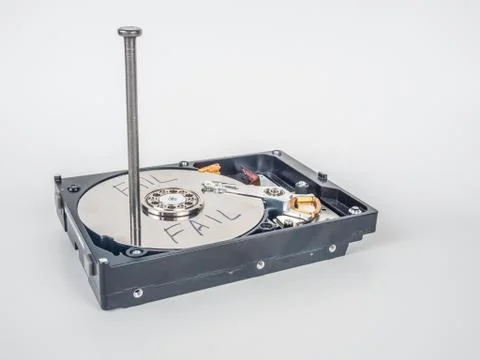 Hard disk with the nail Stock Photos