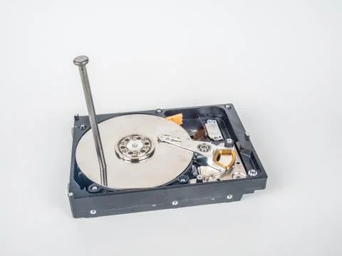 Hard disk with the nail Stock Photos