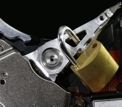 Hard disk with an open padlock as a concept for computer data security Stockfoto's