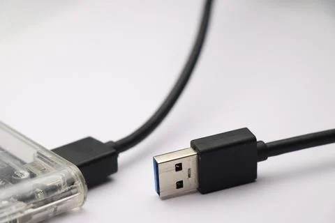 Hard disk with plastic case on white background. Close-up of USB port Foto stock