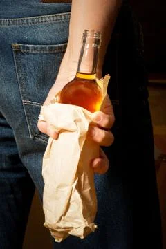 Hard drinker hides a bottle Stock Photos