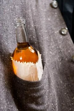 Hard drinker hides a bottle Stock Photos