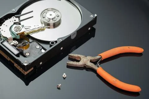 Hard drive from the computer hdd with mirror effect. And repair tools. Stock Photos