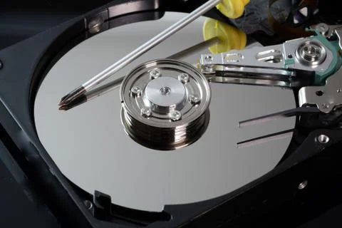 Hard drive from the computer hdd with mirror effect. And repair tools. Stock Photos