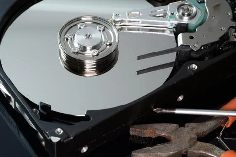 Hard drive from the computer hdd with mirror effect. And repair tools. Stock Photos