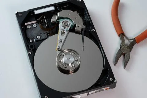 Hard drive from the computer hdd with mirror effect. And repair tools. Stock Photos