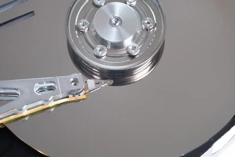 Hard drive from the computer hdd with mirror effect. Close-up, macro. Stock Photos