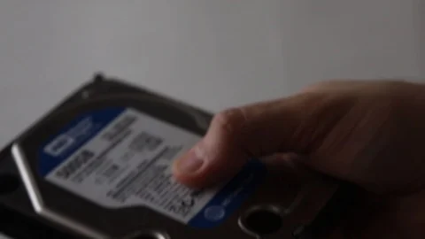 Hard drive in hand Stock Footage 124560738