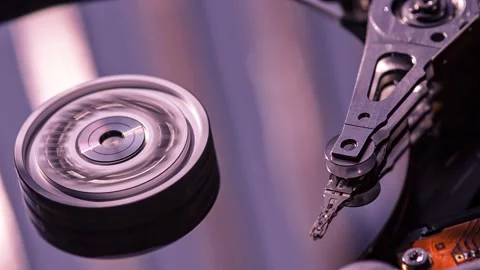 Hard drive head moving over spinning platters Stock Footage 295189670