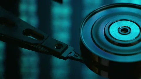  Hard drive inside. Surrounded by lines of code and data flash. Cybersecurity Stock Footage 166556949