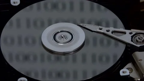 Hard Drive Internal Components Moving with Binary Code Reflecting Stock Footage 145671104