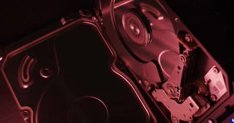 Hard Drive spinning under red light, open Hard Disk enclosure showing inner side Stock Footage 132081351