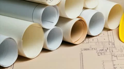 Hard hat and rolls of construction blueprints Stock Footage 21308052