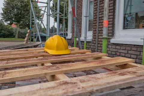 Hard hat on building site Stock Photos