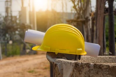 Hard hat placed on the barrier platform. On the construction and development  Stock Photos