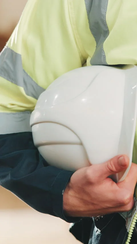 Hard hat, PPE and hands of carpenter in workshop for furniture manufacturing or Stock Footage 343814380