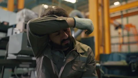 Hard hat worker rests his head in fatigue Видео 346268890