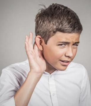 Hard of hearing man placing hand on ear asking to speak up Stock Photos