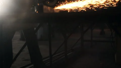 Hard men work. Sparks fly from metal cutting Stock Footage 102053294