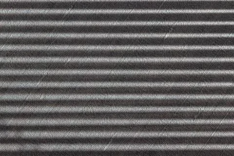 Hard parallel shadows on grey textured wall from a window roller shutter or b Stock Photos